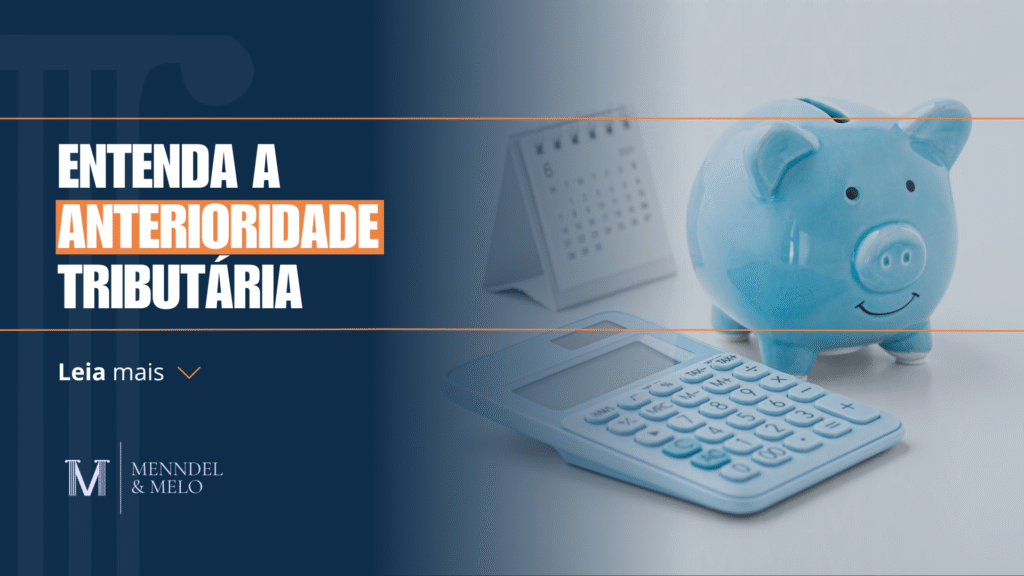 Um cofrinho com uma calculadora ao lado e um texto em primeiro plano "entenda a anterioridade tributária"